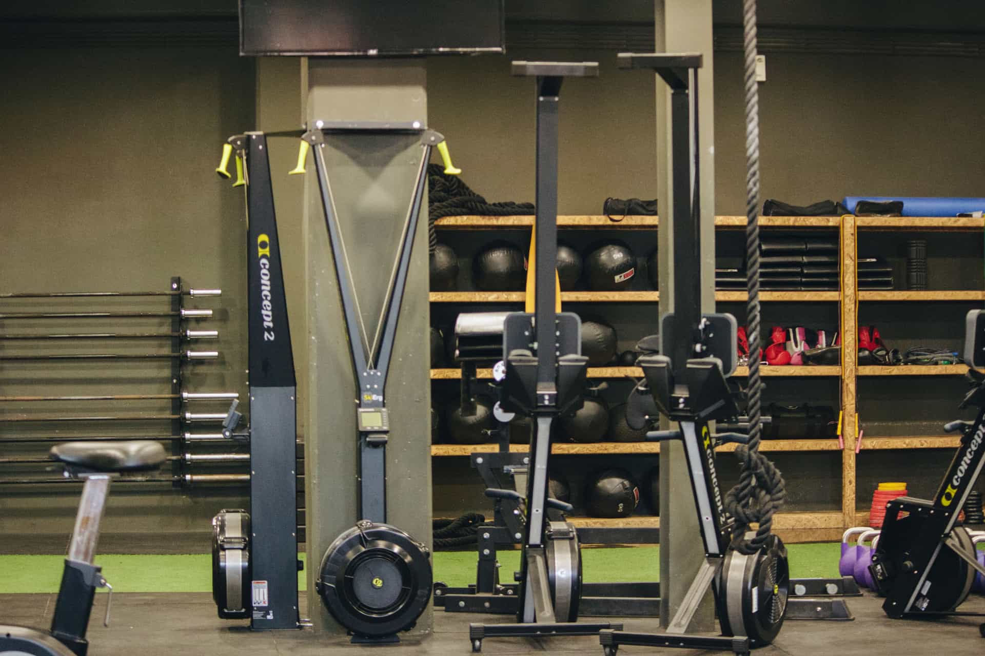 An indoor rowing machine set up in a quiet, naturally lit room